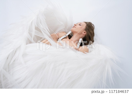 Woman Laying naked in White wings 117184637