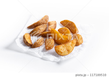 fried potato wedges isolated on white background 117189510