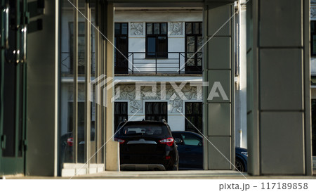 Office building, framing, diagonal, car in the distance 117189858