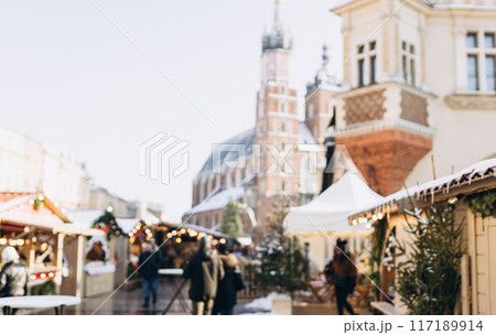 Christmas rush. Blurred area of the old town at Christmas, Christmas market. Christmas decorations on urban trees. Cracow, Poland Christmas rush. Blurred area of the old town at Christmas, Christmas market. Christmas decorations on urban trees. Cracow, Poland 117189914
