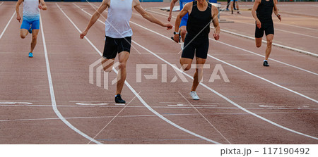 leading runner athlete crosses finish line sprint race 117190492