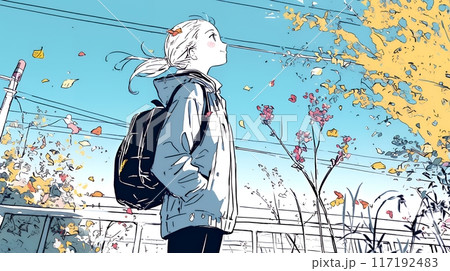 紅葉の秋の公園を歩く若い女性