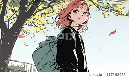 紅葉の秋の公園を歩く若い女性