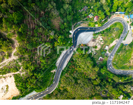 Aerial view of mountain road in forest in summer season, Top view from drone of curve road, Landscape with curved roadway, Beautiful trees Travel asia Phuket Thailand 117194247
