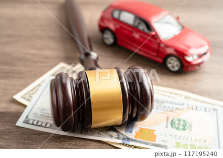Hammer gavel judge and US dollar banknote money with car vehicle accident, insurance coverage claim lawsuit court case. Hammer gavel judge and US dollar banknote money with car vehicle accident, insurance coverage claim lawsuit court case. 117195240