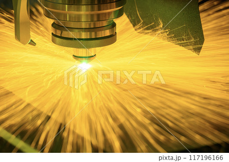 Close up scene the fiber laser cutting machine cut the metal plate with the sparkling light control by CNC program. 117196166