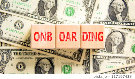 Onboarding success symbol. Concept word Onboarding on wooden blocks. Dollar bills. Beautiful background from dollar bills. Business onboarding success concept. Copy space. 117197438