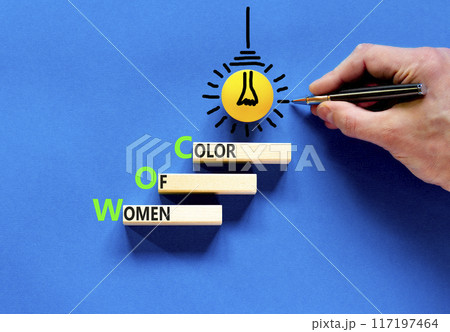 WOC women of color symbol. Concept words WOC women of color on beautiful wooden blocks. Beautiful blue background. Businessman hand. Business WOC women of color social issues concept. Copy space. WOC women of color symbol. Concept words WOC women of color on beautiful wooden blocks. Beautiful blue background. Businessman hand. Business WOC women of color social issues concept. Copy space. 117197464