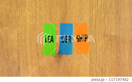 Leadership symbol. Concept word Leadership on beautiful colored paper. Beautiful wooden background. Business leadership concept. Copy space. 117197482
