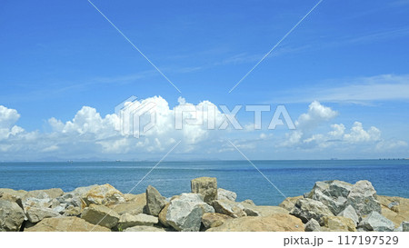 Natural landscape background, blue sky,  white clouds, ocean, coastline and rocks 117197529