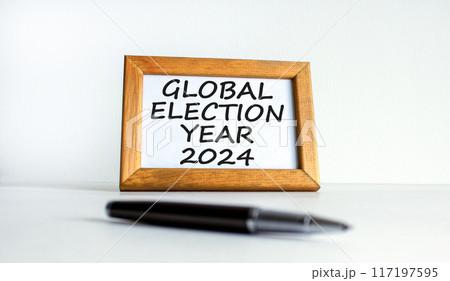 Global election year 2024 symbol. Concept words Global election year 2024 on beautiful white wooden frame. Black pen. Beautiful white background. Business Global election year 2024 concept. Copy space 117197595