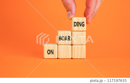 Onboarding success symbol. Concept word Onboarding on wooden blocks. Businessman hand. Beautiful orange background. Business onboarding success concept. Copy space. Onboarding success symbol. Concept word Onboarding on wooden blocks. Businessman hand. Beautiful orange background. Business onboarding success concept. Copy space. 117197635