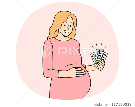 Pregnant woman holds blisters of pills and vitamins to support immunity of baby in womb 117199032