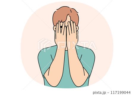 Man closes eyes with hands and peeps, feeling excited in anticipation of surprise or panic 117199044