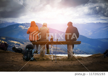 Group of travelers are resting in the mountains. Group of travelers are resting in the mountains. 117202283