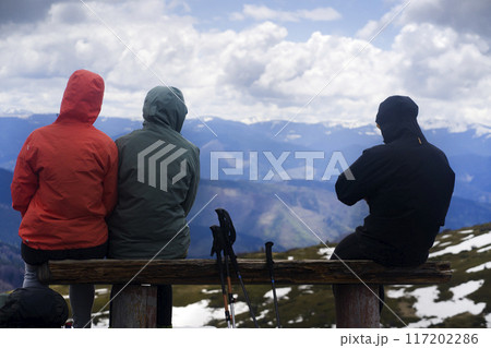Group of travelers are resting in the mountains. Group of travelers are resting in the mountains. 117202286