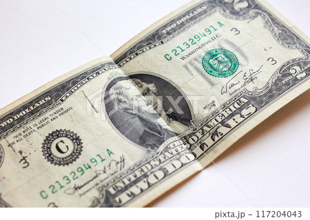 Two US dollar bill, top view point Two US dollar bill, top view point 117204043