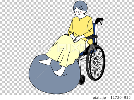 Senior woman in a wheelchair doing rehabilitation with a balance ball Senior woman in a wheelchair doing rehabilitation with a balance ball 117204936