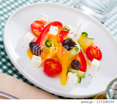 Greek vegetable salad with cheese and olive oil Greek vegetable salad with cheese and olive oil 117206334