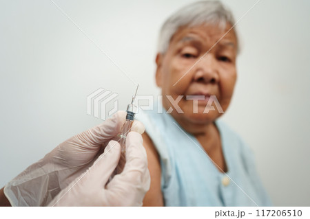doctor make injection vaccine to senior woman doctor make injection vaccine to senior woman 117206510