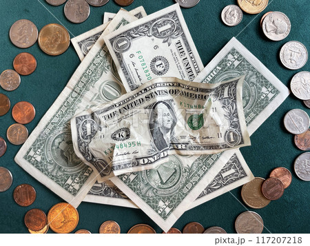 USA coins and banknotes scattered on the table USA coins and banknotes scattered on the table 117207218