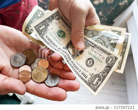 USA banknotes money hold by hand USA banknotes money hold by hand 117207221