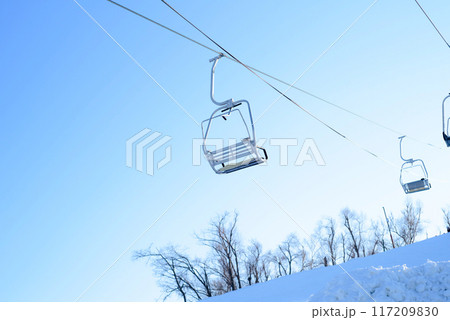 ski resort with ski lift against blue sky in winter ski resort with ski lift against blue sky in winter 117209830