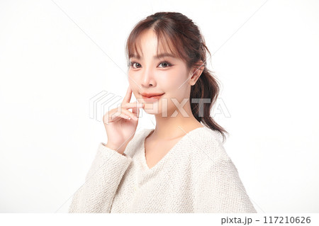 Beautiful young asian woman with clean fresh skin on white background, Face care, Facial treatment, Cosmetology, beauty and spa, Asian women portrait. Beautiful young asian woman with clean fresh skin on white background, Face care, Facial treatment, Cosmetology, beauty and spa, Asian women portrait. 117210626