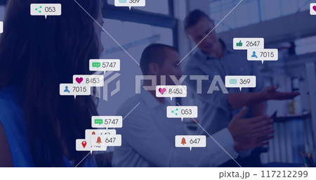 Image of social media notifications over caucasian colleagues talking at office 117212299