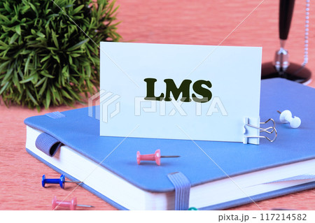 LMS stands for Learning Management System. LMS word on a business card standing on a notepad LMS stands for Learning Management System. LMS word on a business card standing on a notepad 117214582