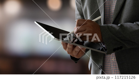 closeup man using his tablet touching screen device isolated screen ONLINE ADVERTISING closeup man using his tablet touching screen device isolated screen ONLINE ADVERTISING 117215126