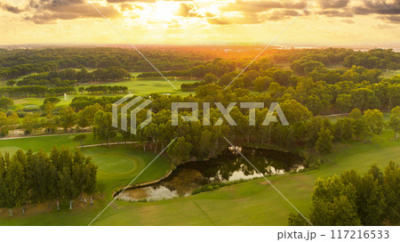 Aerial panoramic view of golf course during sunset 117216533