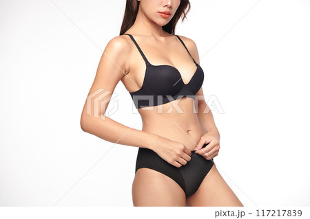 Confident beautiful young asian woman posing in black lingerie on white background, Perfect body, Confident beautiful young asian woman posing in black lingerie on white background, Perfect body, 117217839