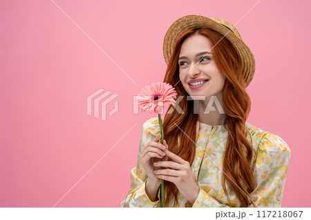 Sweet long-haired young caucasian woman looking happy and relaxed 117218067