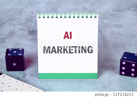 Business AI artificial intelligence marketing concept. Copy space. AI marketing symbol. Concept words AI MARKETING on a notebook on a gray background Business AI artificial intelligence marketing concept. Copy space. AI marketing symbol. Concept words AI MARKETING on a notebook on a gray background 117218223