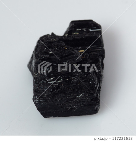 natural black tourmaline scherl on the white background natural black tourmaline scherl on the white background 117221618