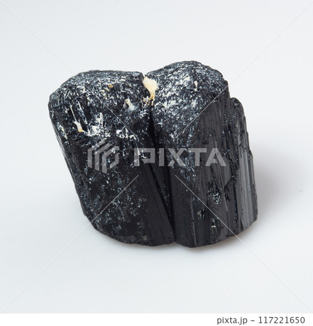 natural black tourmaline scherl on the white background natural black tourmaline scherl on the white background 117221650