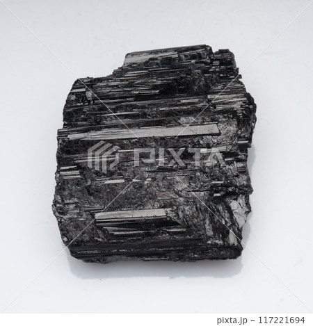natural black tourmaline scherl on the white background natural black tourmaline scherl on the white background 117221694