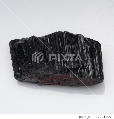 natural black tourmaline scherl on the white background natural black tourmaline scherl on the white background 117221709