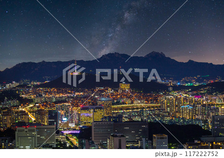 Seoul city skyline and skyscrapers at night with Namsan Mountain and Bukhansan in the background, Seoul, South Korea. Seoul city skyline and skyscrapers at night with Namsan Mountain and Bukhansan in the background, Seoul, South Korea. 117222752
