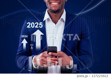A man is holding a cell phone and smiling 117223022