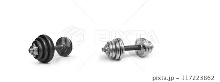 Metal dumbbells on a white background. Gym, fitness and sports equipment symbols. text input area Metal dumbbells on a white background. Gym, fitness and sports equipment symbols. text input area 117223862