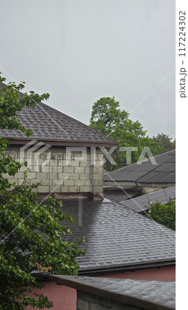 Houses against the backdrop of nature. Dark sky. Rainy weather. Houses against the backdrop of nature. Dark sky. Rainy weather. 117224302