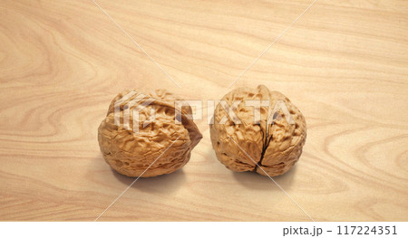 Walnuts on wooden background, front view Walnuts on wooden background, front view 117224351