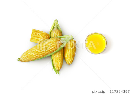Corn and corn juice in glass isolated on white background. Top view. 117224397