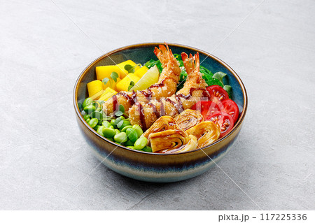 Poke bowl with red shrimps and vegetables in the bowl.Top view. Closeup. High quality photo Poke bowl with red shrimps and vegetables in the bowl.Top view. Closeup. High quality photo 117225336