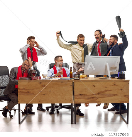Noisy group of men, workers watching soccer match and supporting favorite team against white studio background. Noisy group of men, workers watching soccer match and supporting favorite team against white studio background. 117227066