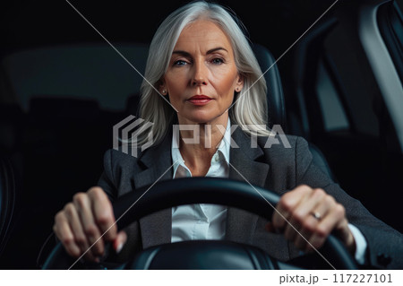 Joyful Senior Executive Behind the Wheel Joyful Senior Executive Behind the Wheel 117227101