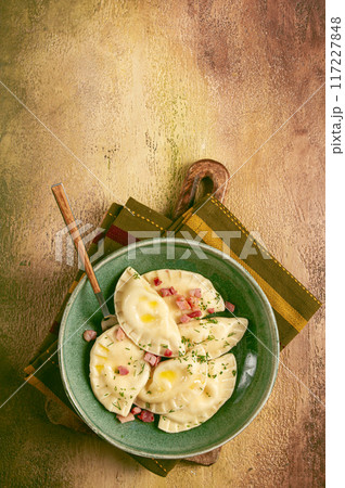 Dumplings, with fried prosciutto, a traditional dish of Polish cuisine, dumplings, top view, close-up, without people, Dumplings, with fried prosciutto, a traditional dish of Polish cuisine, dumplings, top view, close-up, without people, 117227848