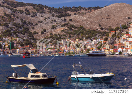 Bright colorful houses on the shore of the bay in the Greek fishing village Symi Bright colorful houses on the shore of the bay in the Greek fishing village Symi 117227894